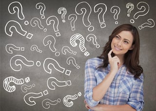 Attractive woman thinking on grey background.jpeg