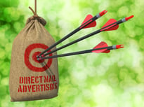 Direct Mail Advertising - Three Arrows Hit in Red Target on a Hanging Sack on Natural Bokeh Background..jpeg