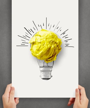 hand drawn light bulb with crumpled paper ball on paper poster as creative concept