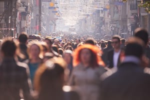 people crowd walking on busy street on daytime